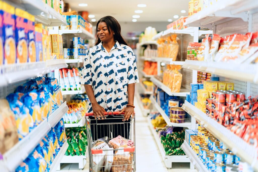 pexels-photo-30688912 A woman enjoying grocery shopping in a vibrant Lagos supermarket aisle.